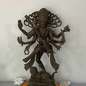 A statue of an indian deity is shown.